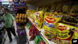 Packaged food with "Maggi" sign on it are displayed at a grocery store in Bangalore, India, June 5, 2015. 