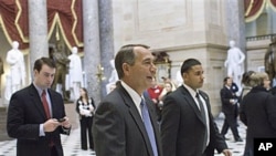 House Speaker John Boehner of Ohio walks through Statuary Hall on Capitol Hill in Washington, Jan 6, 2011