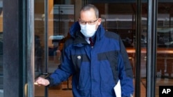 Harvard University professor Charles Lieber leaves federal court, Dec. 14, 2021, in Boston.