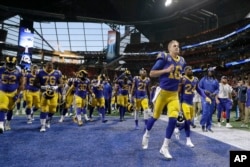 Los Angeles Rams players are seen before the NFL Super Bowl football game between the Rams and the New England Patriots, Feb. 3, 2019, in Atlanta.
