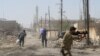 Les forces irakiennes à Mossoul appellent les djihadistes à se rendre