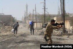 Iraqi soldiers say the Old City is surrounded, but the frontlines are fluid as IS continues to fight to expand, taken in Mosul, Iraq, June 15, 2017.