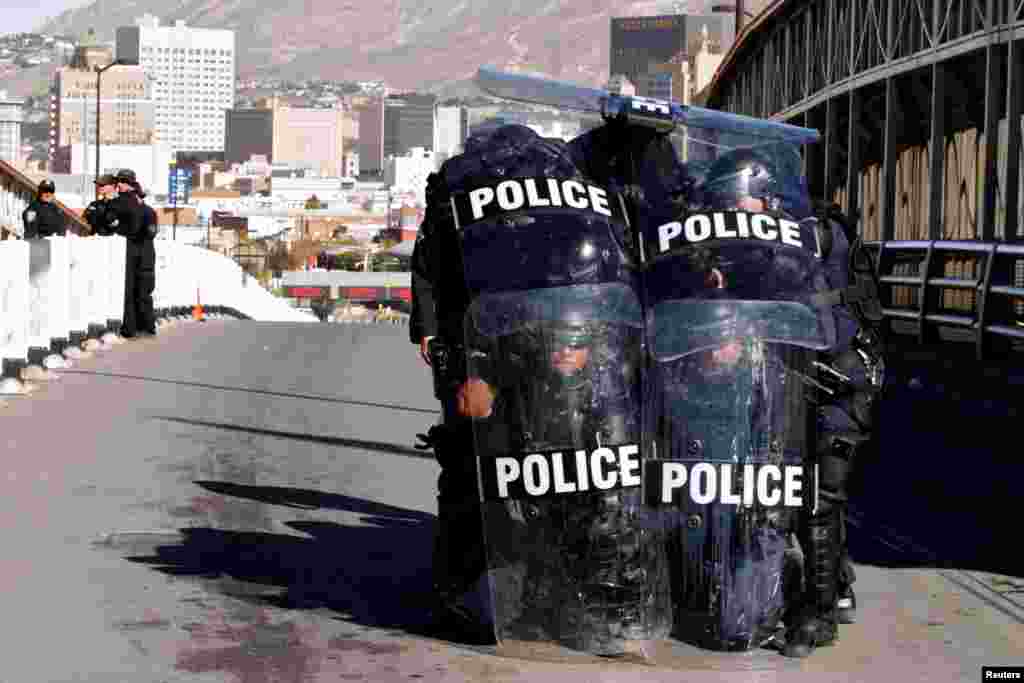 U.S. Custom and Border Protection agents with full riot gear take part in a drill to protect the crossing gates against people who want to cross the border illegally on the international bridge between Mexico and the U.S., in Ciudad Juarez, Mexico, Oct. 29, 2018.