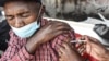 FILE - A man gets a COVID-19 vaccine in Nairobi, Kenya, on Sept. 17, 2021. 