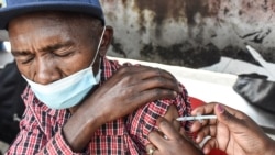 FILE - A man gets a COVID-19 vaccine in Nairobi, Kenya, on Sept. 17, 2021.