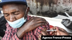 FILE - A man gets a COVID-19 vaccine in Nairobi, Kenya, on Sept. 17, 2021.