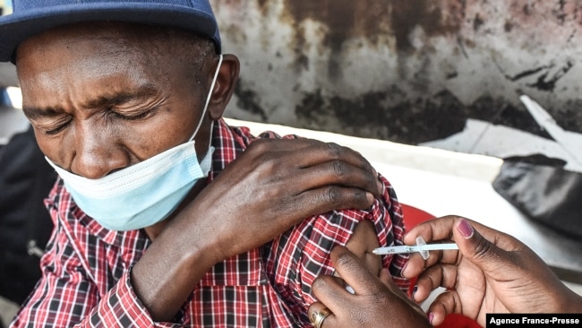 FILE - A man gets a COVID-19 vaccine in Nairobi, Kenya, on Sept. 17, 2021.