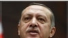 Premye Minis Turk la Egzòte Prezidan Siryen an Pou l Demisyone
