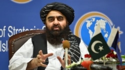 The Taliban's foreign minister, Amir Khan Muttaqi, gestures while speaking during an event held at the Institute of Strategic Studies in Islamabad, Pakistan, Nov. 12, 2021.