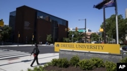 FILE - In this May 15, 2019, file photo Drexel University in Philadelphia. Students at more than 25 universities are filing lawsuits demanding tuition refunds from their schools. (AP Photo/Matt Rourke, File)