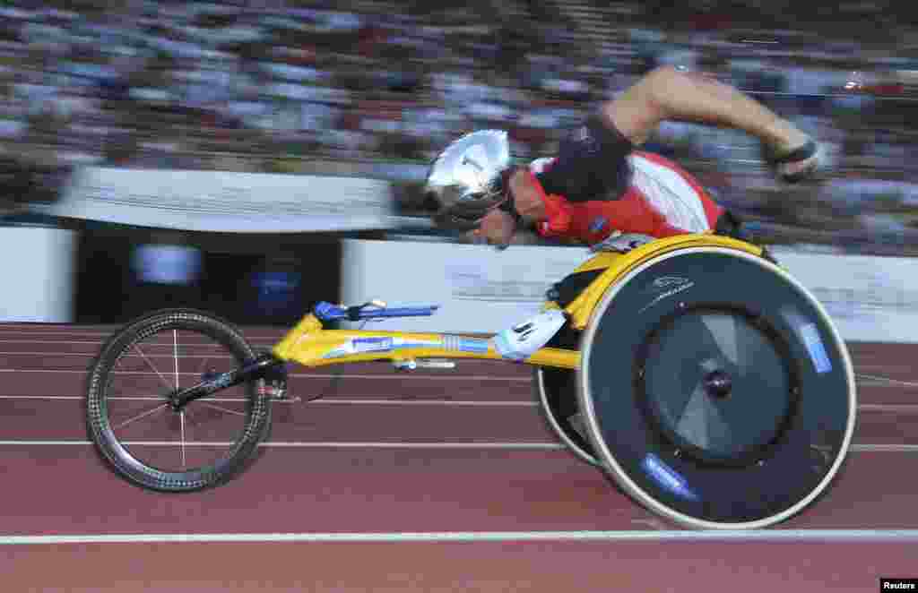 Marcel Hug of Switzerland competes in the men&#39;s 1,500m wheelchair competition at Stade Olympique de la Pontaise, Lausanne, Switzerland.
