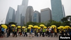 South Koreans march towards the National Assembly at Yeouido Park in Seoul, caring signatures of petitions for the enactment of a special law after the ferry disaster, July 15, 2014.