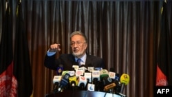 Afghan presidential candidate Zalmai Rassoul gestures during a press conference in Kabul on April 6, 2014.