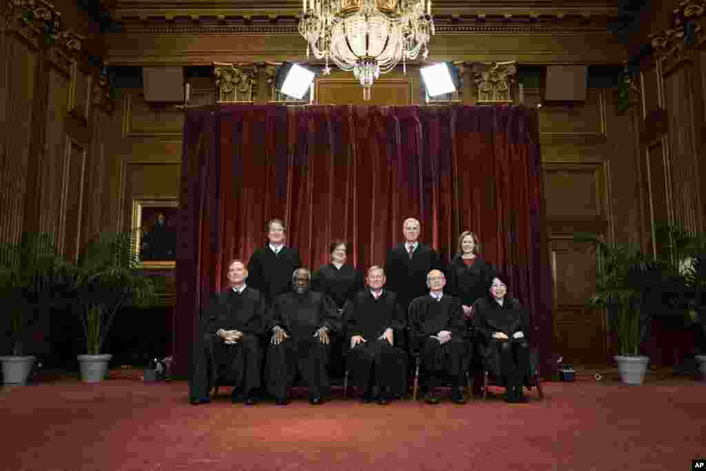 Members of the Supreme Court pose for a group photo at the Supreme Court in Washington, Friday, April 23, 2021. Seated from left are Associate Justice Samuel Alito, Associate Justice Clarence Thomas, Chief Justice John Roberts, Associate Justice Stephen B