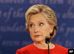Democratic presidential nominee Hillary Clinton listens to Republican presidential nominee Donald Trump during the presidential debate at Hofstra University in Hempstead, N.Y., Sept. 26, 2016.