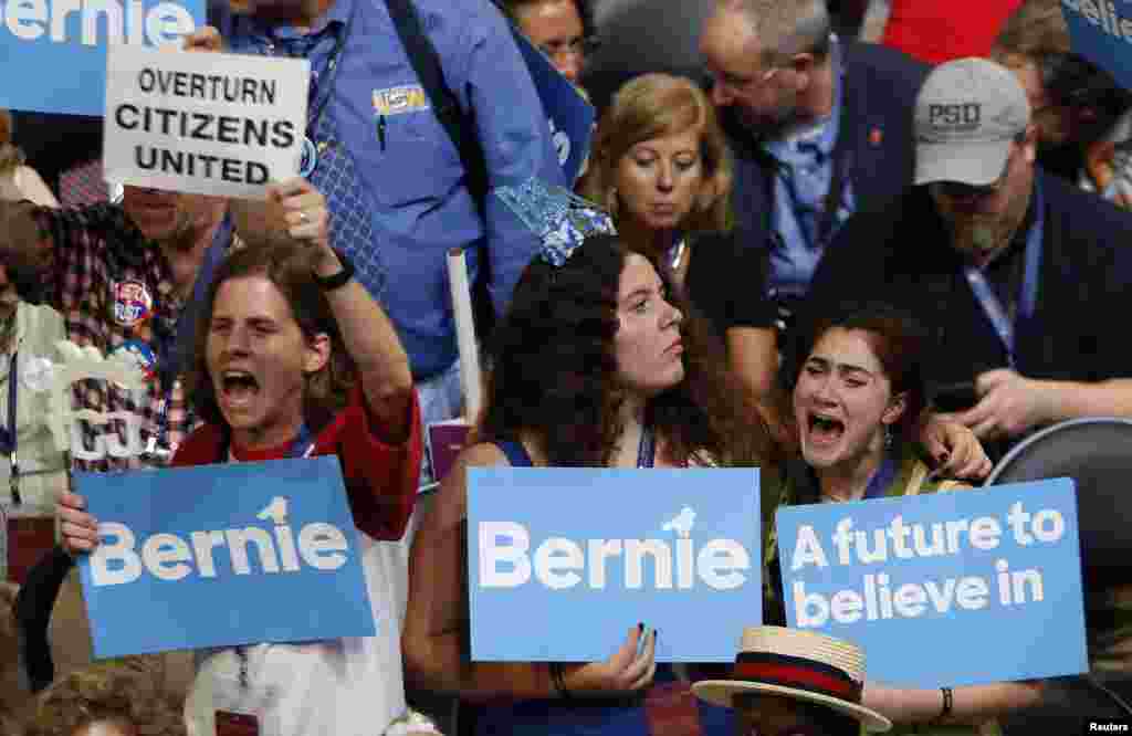 Supporters of Senator Bernie Sanders (D-VT) react as they listen to him during the Democratic National Convention in Philadelphia, Pennsylvania, July 25, 2016.