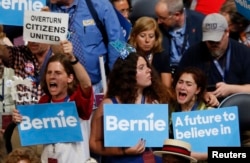 Supporters of Senator Bernie Sanders (D-VT) react as they listen to him speak during the Democratic National Convention in Philadelphia, Pennsylvania, U.S. July 25, 2016.