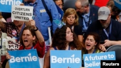 Supporters of Senator Bernie Sanders, a self-proclaimed democratic socialist who competed against Hillary Clinton for the Democratic presidential nomination, react as they listen to him speak during the Democratic National Convention in Philadelphia, Pennsylvania, July 25, 2016. 