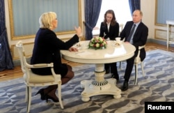 Russian President Vladimir Putin meets with Marine Le Pen, French National Front (FN) political party leader and candidate for the French 2017 presidential election, in Moscow, Russia, March 24, 2017.