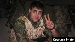 Iranian Amir Qobadi pictured in a YPG uniform in 2014, who died fighting IS militants. (courtesy of YPG Media Center)