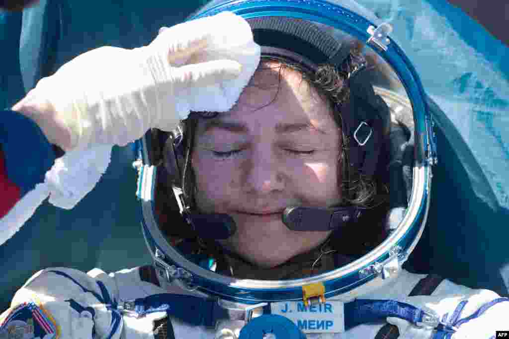 NASA astronaut Jessica Meir rests after landing in a remote area outside of Dzhezkazgan, Kazakhstan. Two NASA astronauts and a Russian cosmonaut returned from the International Space Station to find the planet transformed by the coronavirus pandemic.