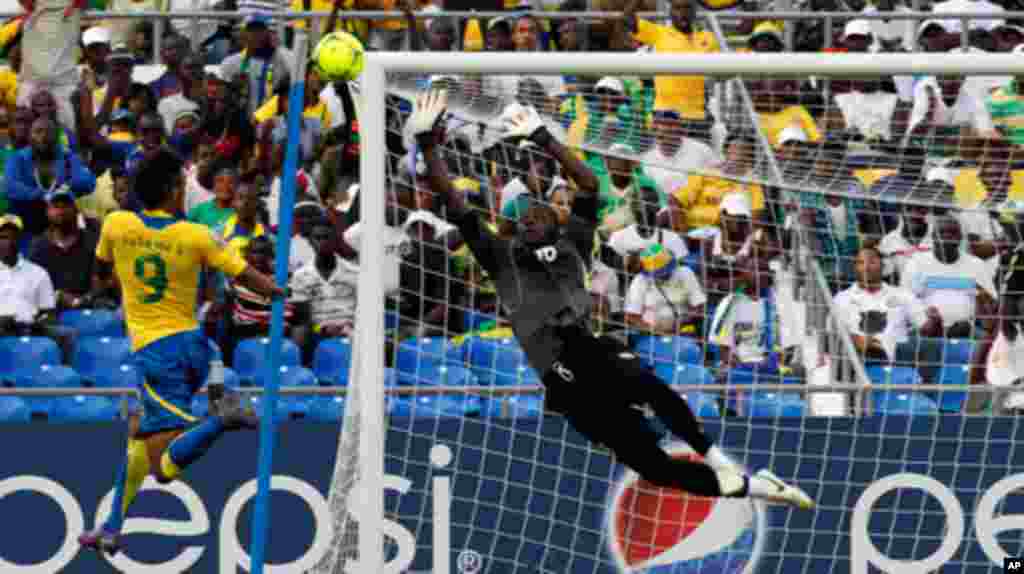 Gabon's Emerick scores past Niger's Saminou during their African Cup of Nations soccer match in Libreville