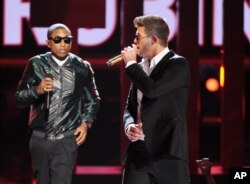 Pharrell Williams, left, and Robin Thicke perform onstage at the BET Awards at the Nokia Theater, June 30, 2013, in Los Angeles.