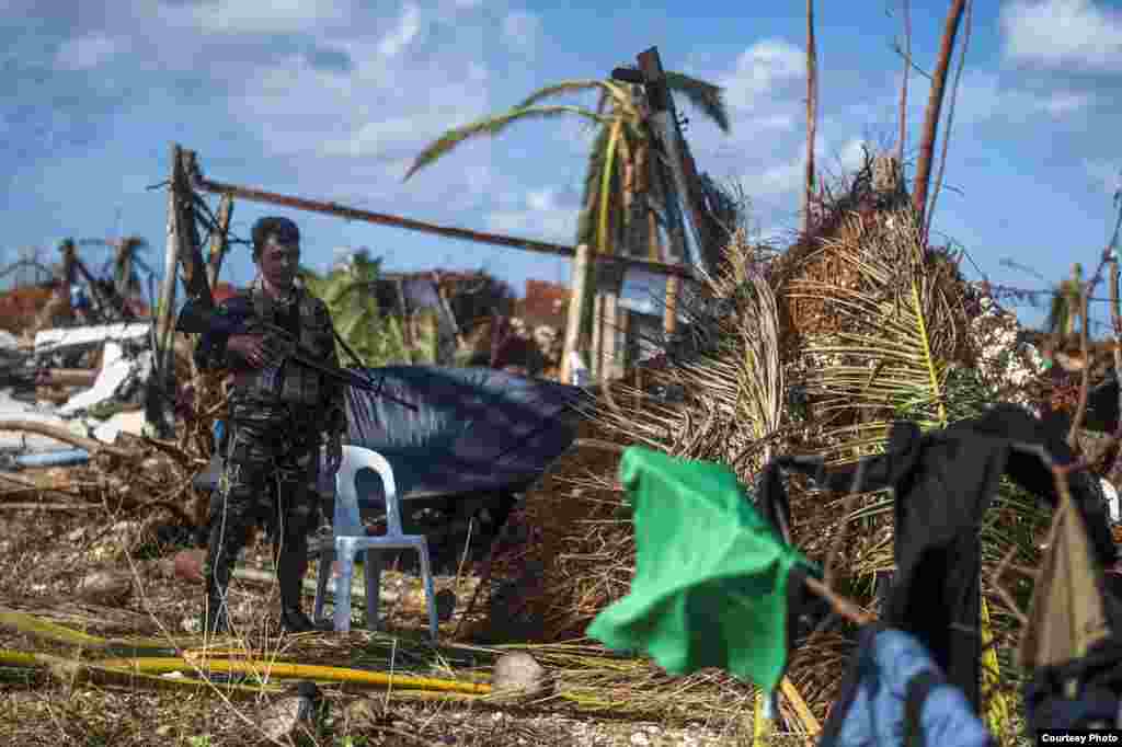 A Philippines Marine stands guard at the village of Guiuan, Eastern Samar Province, Nov. 15, 2013. (U.S. Navy)&nbsp;
