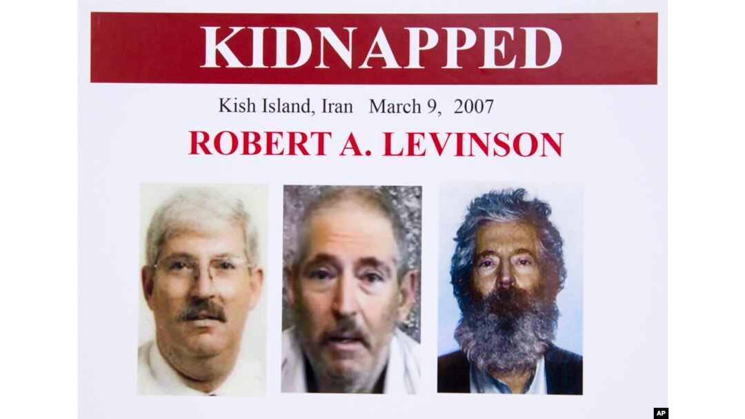 FILE- An FBI poster showing a composite image of former FBI agent Robert Levinson (right) of how he would look like now after five years in captivity, and an image (center) taken from the video, released by his kidnappers, and a picture before he was kidnapped.