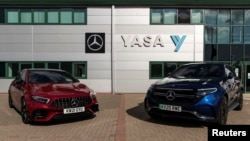 Two electric cars are parked at YASA headquarters and production facility in Oxford, Britain, August 24, 2021. Picture taken August 24, 2021. REUTERS/May James