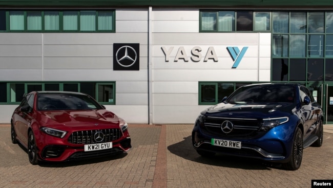 Two electric cars are parked at YASA headquarters and production facility in Oxford, Britain, August 24, 2021. Picture taken August 24, 2021. REUTERS/May James