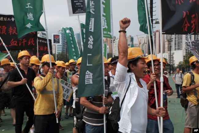 Workers march during a rally to mark the May Day in Hong Kong, May 1, 2019.