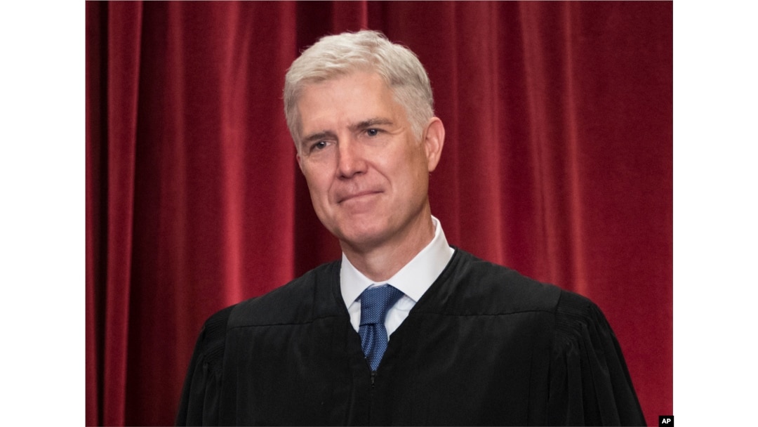 Associate Justice Neil Gorsuch joins other justices of the U.S. Supreme Court for an official group portrait at the Supreme Court Building in Washington. June 1, 2017.