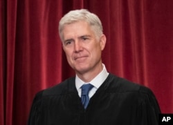 FILE - Associate Justice Neil Gorsuch joins other justices of the U.S. Supreme Court for an official group portrait at the Supreme Court Building in Washington, June 1, 2017.