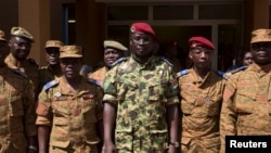 Lieutenant Colonel Yacouba Isaac Zida (C) poses for a picture after a news conference in which he was named president at the military headquarters in Ouagadougou, Nov. 1, 2014. 