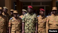 Lieutenant Colonel Yacouba Isaac Zida (C) poses for a picture after a news conference in which he was named president at the military headquarters in Ouagadougou, Nov. 1, 2014. 