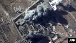 A video grab made on October 12, 2015, shows an image taken from a footage made available on the Russian Defense Ministry's official website, purporting to show explosions after airstrikes carried out by Russian air force on what Russia says was an Islamic State training camp in the Syrian province of Idlib.