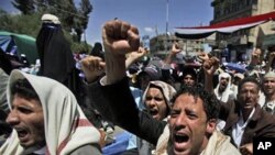 Anti-government protesters shout slogans during a demonstration demanding the resignation of Yemeni President Ali Abdullah Saleh, in Sana'a, March 11, 2011