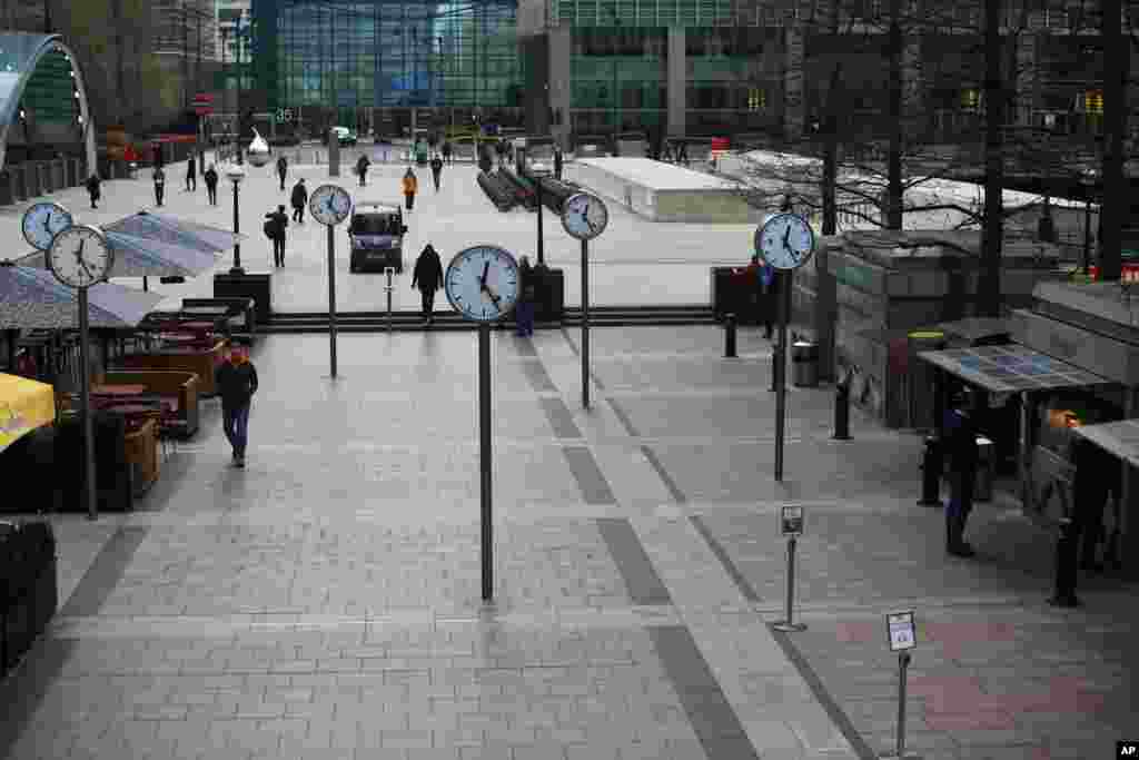 A usually crowded Canary Wharf is seen at lunchtime as the number of coronavirus cases grow in London.