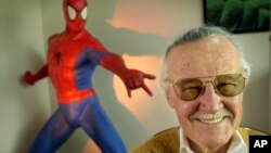 FILE - Stan Lee, creator of comic-book franchises such as "Spider-Man," "The Incredible Hulk" and "X-Men," smiles during a photo session in his office in Santa Monica, Calif., April 16, 2002.
