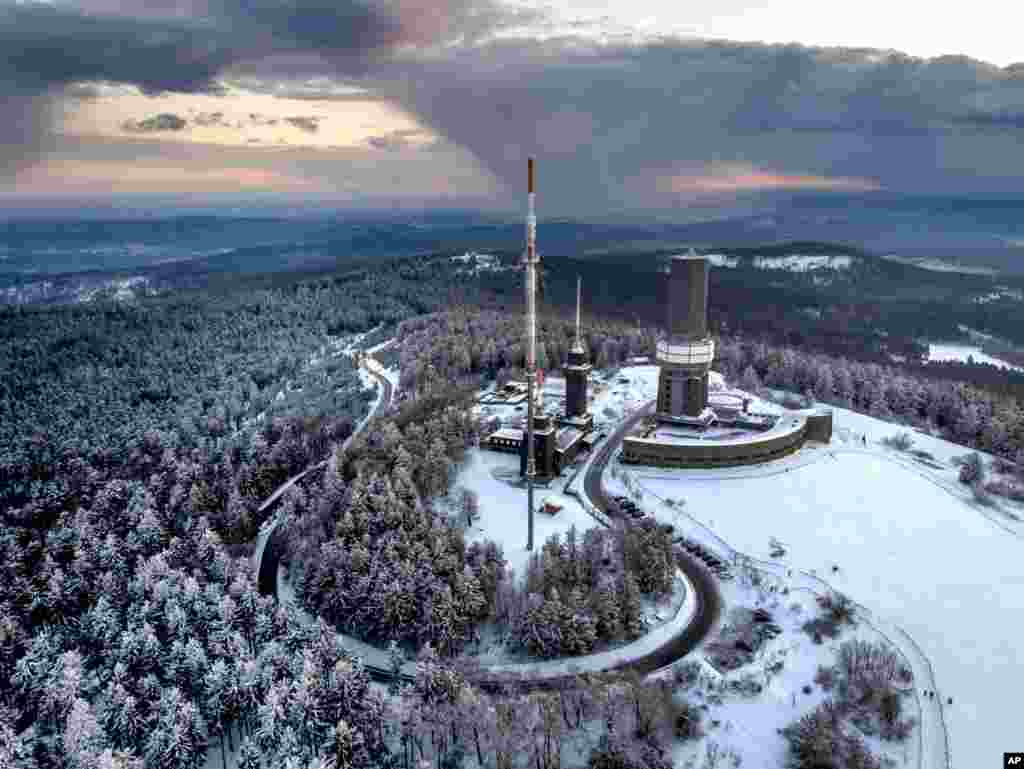 The top of the Feldberg mountain is covered with freshly fallen snow near Frankfurt, Germany, Friday, March 19, 2021. (AP Photo/Michael Probst)