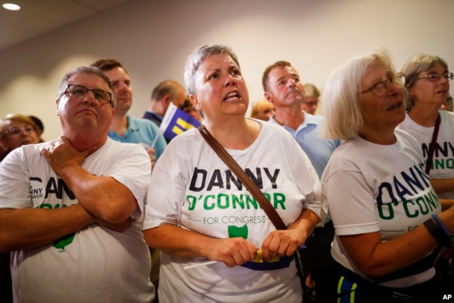 Supporters of Danny O'Connor, the Franklin County recorder, anxiously watch results during an election night watch party at the Ohio Civil Service Employees Association in Westerville, Ohio, Aug. 7, 2018.