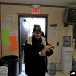 Lakota Country Times publisher Connie Smith arrives with the current issue of the Mustang News.