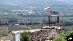 An Iranian flag flies above a hilltop park overlooking Israel, 02 Sep 2010. The garden was a gift from Tehran to the people of South Lebanon.