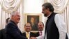 FILE - U.S. Secretary of State Rex Tillerson shakes hands with Pakistani Prime Minister Shahid Khan Abbasi before their meeting at the prime minister's residence, in Islamabad, Pakistan, Oct. 24, 2017.