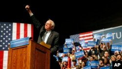 Democratic presidential candidate Sen. Bernie Sanders, I-Vt., gestures to supporters during a campaign rally in Laramie, Wyo., Tuesday, April 5, 2016.