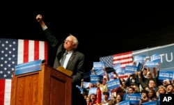 Democratic presidential candidate Sen. Bernie Sanders, I-Vt., gestures to supporters during a campaign rally in Laramie, Wyo., Tuesday, April 5, 2016.
