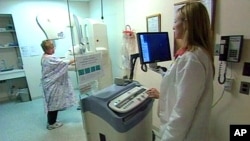 FILE - A woman undergoes a mammogram.