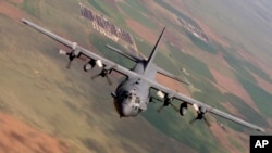 FILE - A U.S. AC-130 Spectre gunship, like the one pictured, and U.S. A-10 warplanes launched from Turkey's Incirlik Air Base supported the Syrian Democratic Fores in the operation around al-Hawl, Syria.