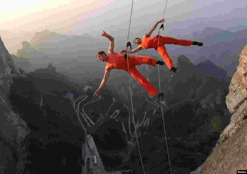 A dance group performs on the cliffs in Zhangjiajie, Hunan province, China.